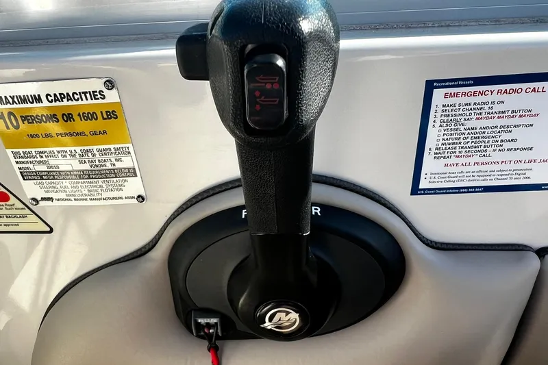 Slide: The Image of Throttle control and safety instructions on a 2003 Sea Ray 220 Sundeck boat. - 20