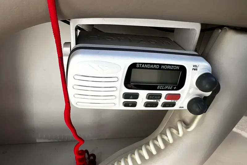 Slide: The Image of Standard Horizon Eclipse+ radio on 2003 Sea Ray 220 Sundeck boat dashboard. - 21