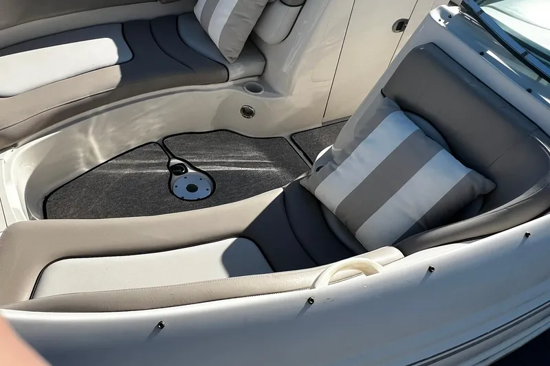 Slide: The Image of Interior seating of 2003 Sea Ray 220 Sundeck with striped cushion. - 7