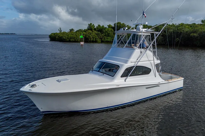 The Image of 2008 Ocean Yachts 37 Billfish cruising on calm waters under cloudy skies. - 0