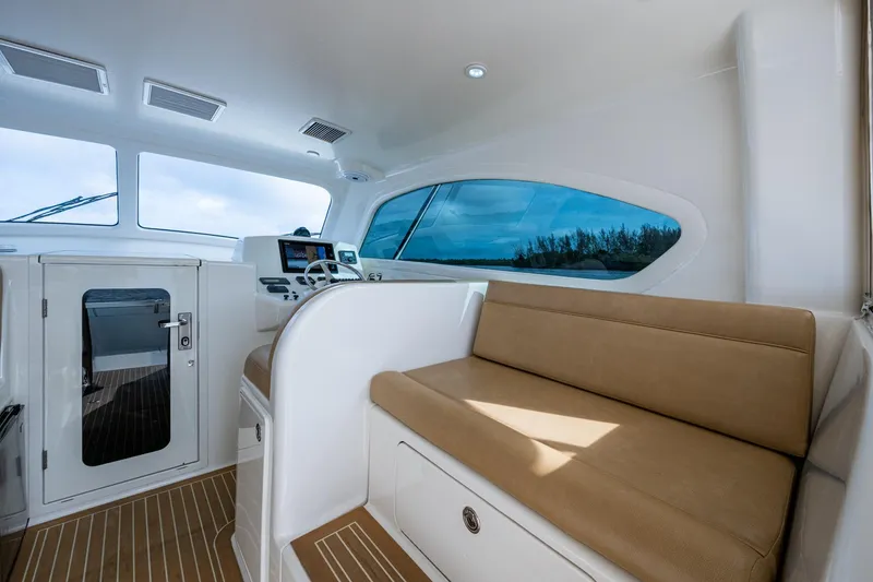 Slide: The Image of Interior of 2008 Ocean Yachts 37 Billfish, featuring helm and seating area. - 24