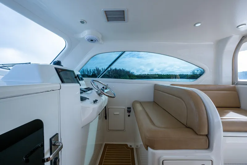 Slide: The Image of Interior of 2008 Ocean Yachts 37 Billfish, featuring helm and seating area. - 25