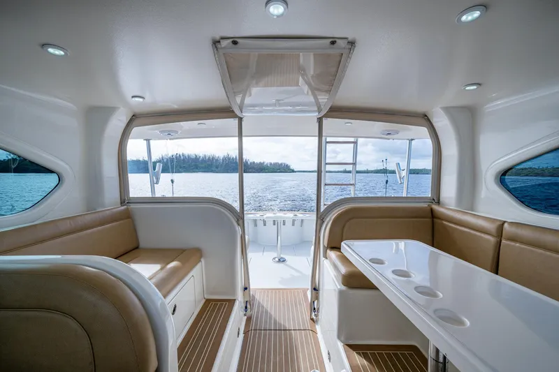Slide: The Image of Interior of 2008 Ocean Yachts 37 Billfish, featuring seating and table, overlooking water. - 27