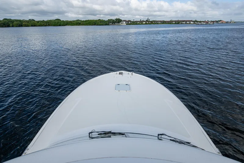 Slide: The Image of Bow view of 2008 Ocean Yachts 37 Billfish on calm water under cloudy sky. - 29