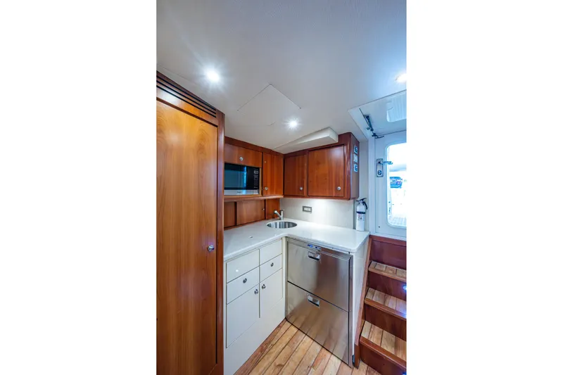 Slide: The Image of Luxurious 2008 Ocean Yachts 37 Billfish galley with wood cabinetry and modern appliances. - 39