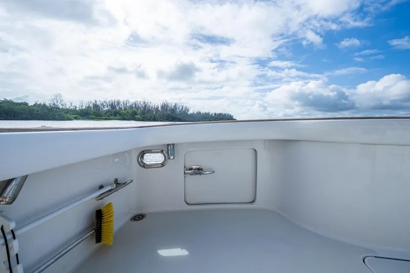 Slide: The Image of 2008 Ocean Yachts 37 Billfish deck view with clear sky and shoreline. - 41