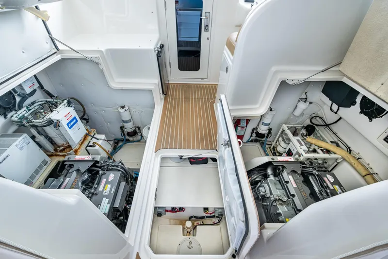 Slide: The Image of Engine room of 2008 Ocean Yachts 37 Billfish, showcasing dual engines and equipment. - 47