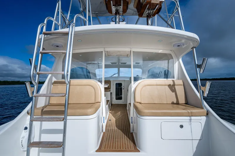 Slide: The Image of 2008 Ocean Yachts 37 Billfish boat interior with seating and ladder, on calm water. - 20