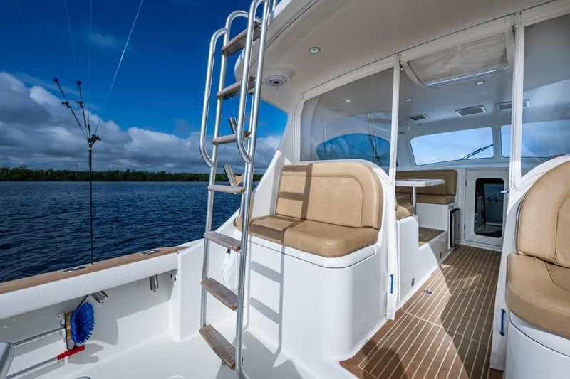 Slide: The Image of 2008 Ocean Yachts 37 Billfish interior with seating, ladder, and ocean view. - 21
