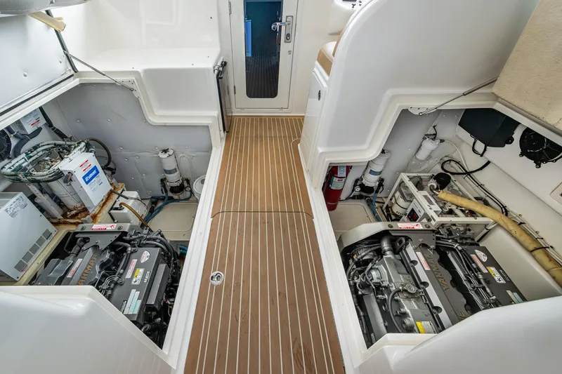 Slide: The Image of Engine room of 2008 Ocean Yachts 37 Billfish, showcasing dual engines and equipment. - 45