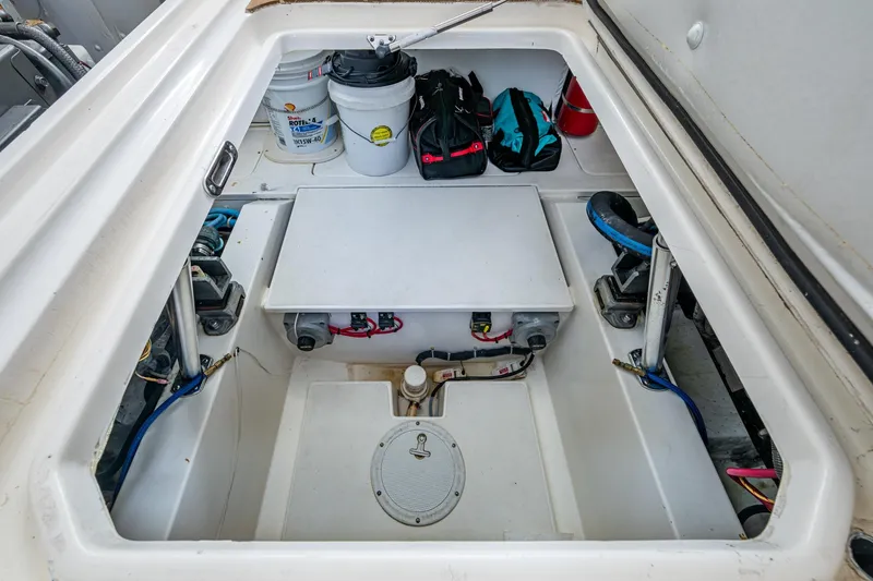 Slide: The Image of Engine compartment of 2008 Ocean Yachts 37 Billfish with storage and equipment. - 46