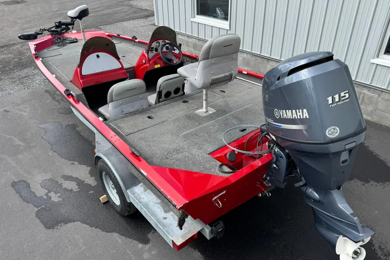 Slide: The Image of 2013 Alumacraft Pro 185 boat with Yamaha 115 engine, red and gray design. - 3