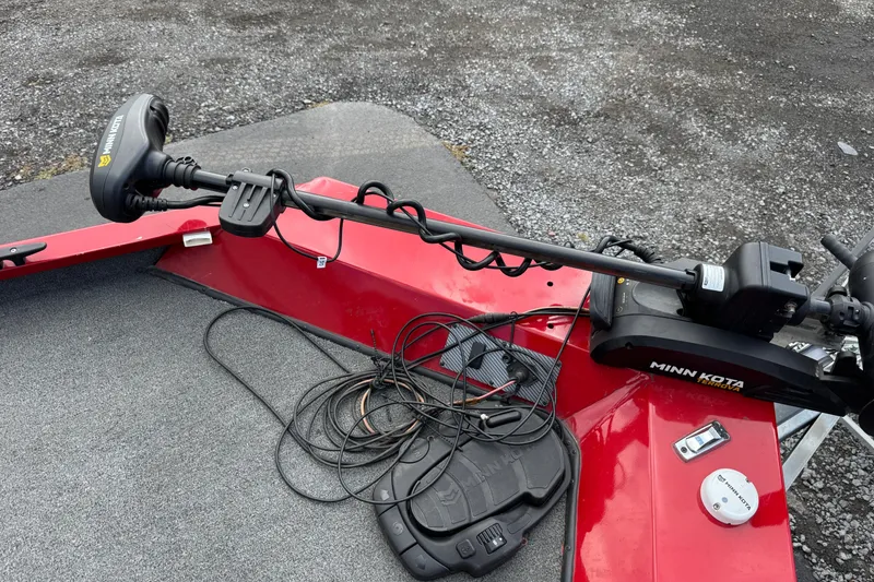 Slide: The Image of 2013 Alumacraft Pro 185 boat with Minn Kota trolling motor on red deck. - 5
