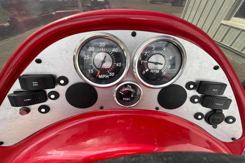 Slide: The Image of Dashboard of 2013 Alumacraft Pro 185 boat with speedometer and RPM gauges. - 8