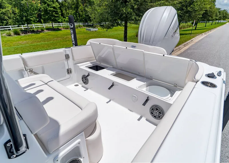 Slide: The Image of 2026 Sea Hunt Ultra 245 SE boat interior with seating and storage compartments. - 8