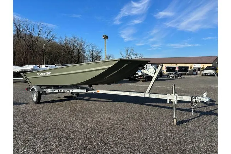 Slide: The Image of 2024 Polar Kraft MV1648 Jon Boat with trailer, parked outdoors under blue sky. - 3