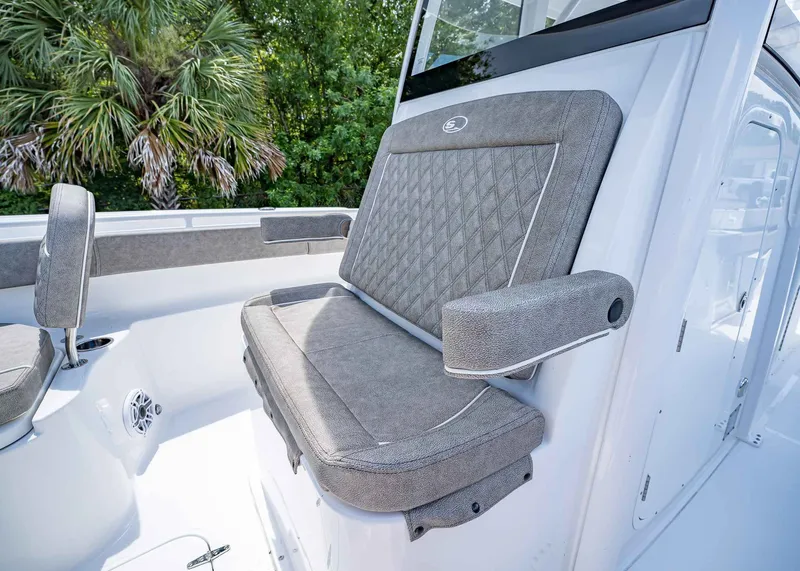 Slide: The Image of 2026 Sea Hunt Ultra 305 SE boat seat with gray upholstery and diamond stitching. - 35