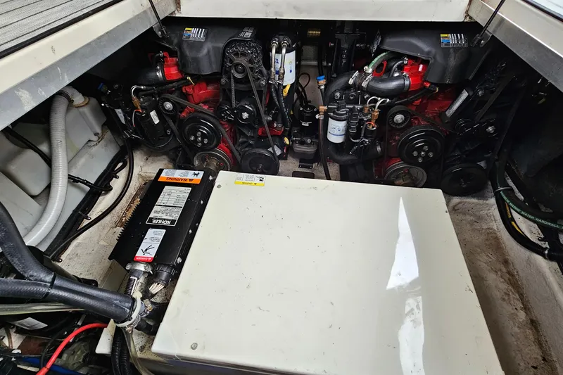 Slide: The Image of Engine compartment of a 2004 Monterey 282 Cruiser boat, showcasing mechanical components. - 20