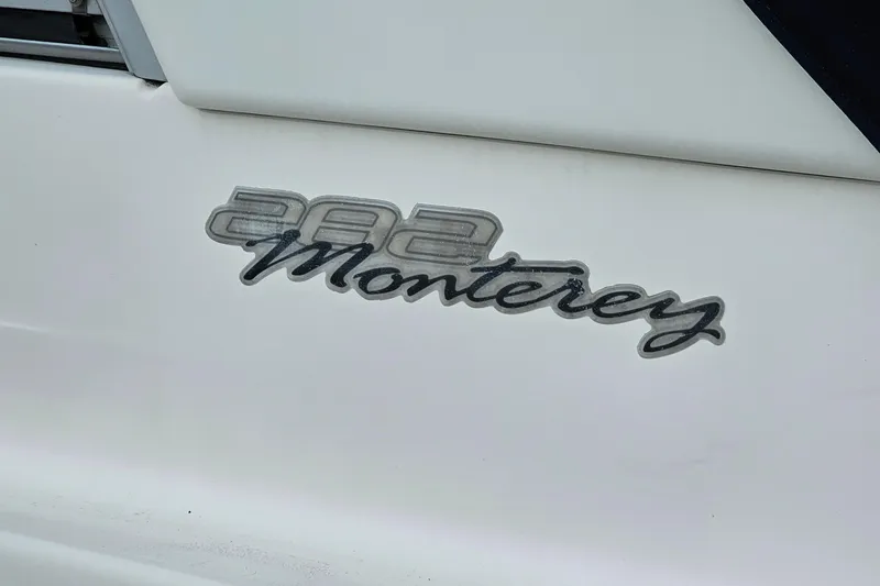 Slide: The Image of 2004 Monterey 282 Cruiser logo on white surface. - 23
