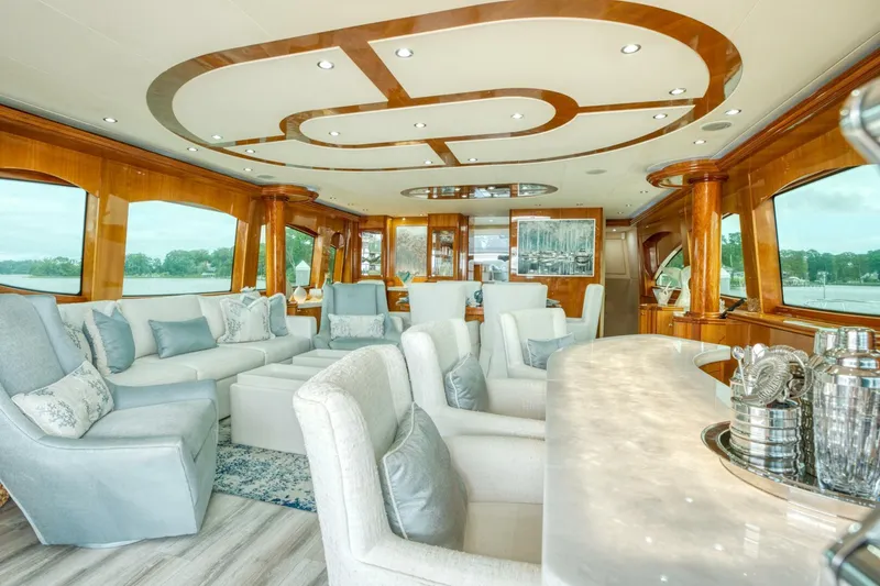 Slide: The Image of Luxurious interior of 2007 Hatteras 80 Enclosed Bridge yacht with elegant seating and decor. - 13