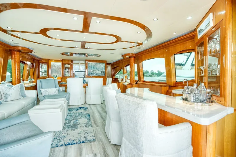 Slide: The Image of Luxurious interior of 2007 Hatteras 80 Enclosed Bridge yacht with elegant seating and wood accents. - 14