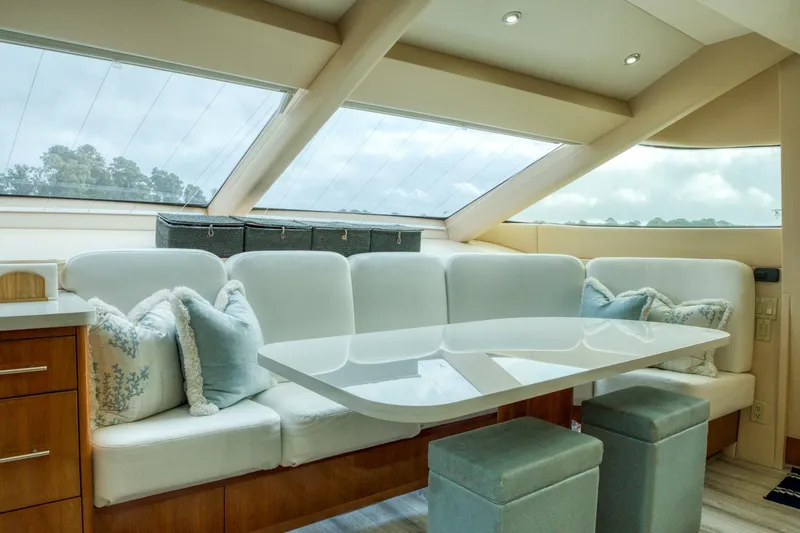 Slide: The Image of Luxurious interior of 2007 Hatteras 80 Enclosed Bridge yacht with plush seating and modern design. - 17