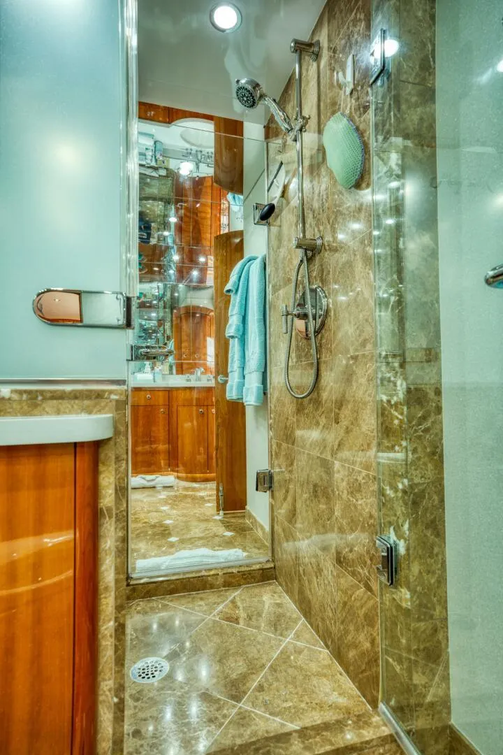 Slide: The Image of Luxurious bathroom with marble shower in 2007 Hatteras 80 Enclosed Bridge yacht. - 29