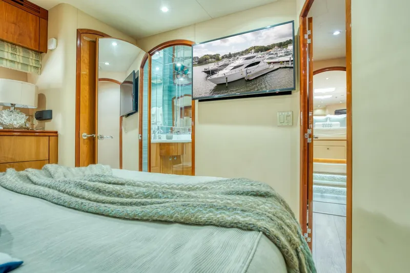 Slide: The Image of Luxurious interior of 2007 Hatteras 80 Enclosed Bridge yacht, featuring elegant bedroom and modern amenities. - 34