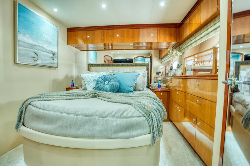 Slide: The Image of Luxurious bedroom interior of 2007 Hatteras 80 Enclosed Bridge yacht with elegant wood finishes. - 35