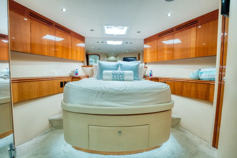 Slide: The Image of Luxurious bedroom interior of 2007 Hatteras 80 Enclosed Bridge yacht with elegant wood finishes. - 38