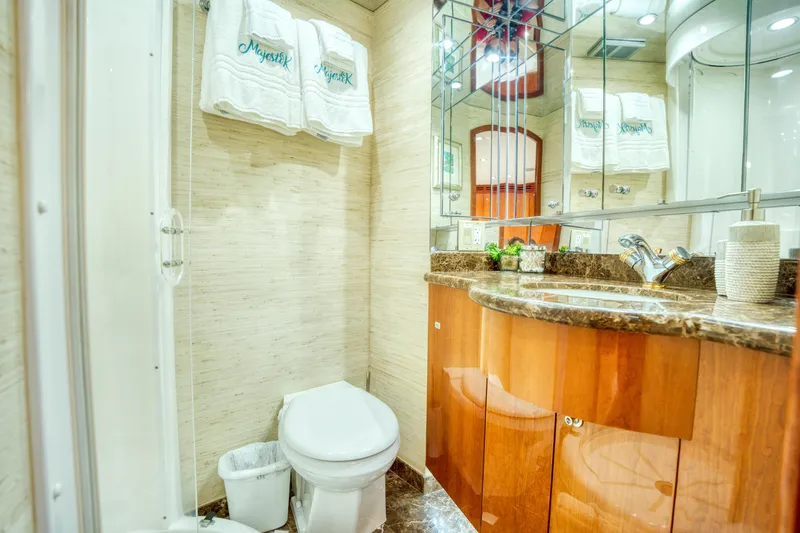 Slide: The Image of Luxurious bathroom in 2007 Hatteras 80 Enclosed Bridge yacht with elegant wood cabinetry. - 40