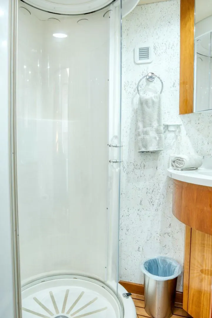 Slide: The Image of Shower area in 2007 Hatteras 80 Enclosed Bridge yacht bathroom, featuring modern amenities. - 43