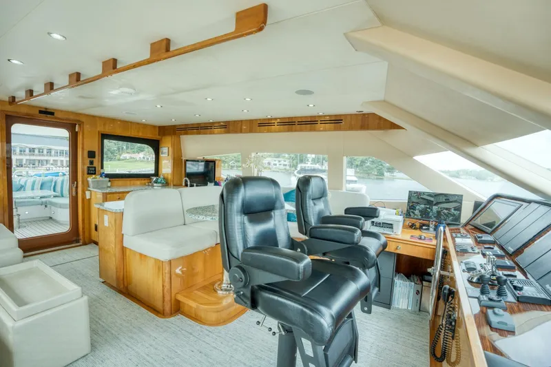 Slide: The Image of Luxurious interior of 2007 Hatteras 80 Enclosed Bridge yacht with modern navigation equipment. - 46