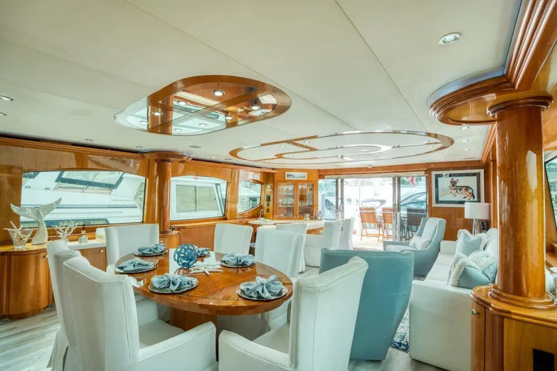 Slide: The Image of Luxurious interior of 2007 Hatteras 80 Enclosed Bridge yacht with elegant dining area. - 5