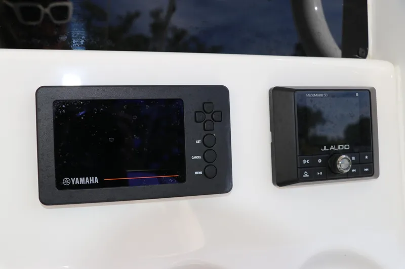 Slide: The Image of Yamaha and JL Audio controls on 2020 Tidewater 252 LXF boat dashboard. - 26