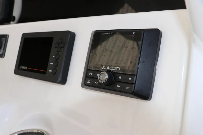 Slide: The Image of Control panel of a 2020 Tidewater 252 LXF boat featuring JL Audio and Yamaha displays. - 27