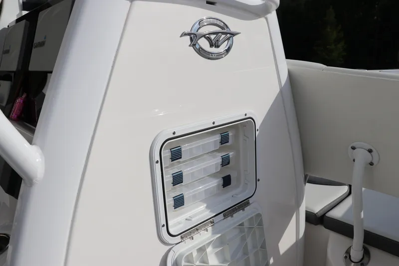 Slide: The Image of 2020 Tidewater 252 LXF boat with storage compartment and logo detail. - 35