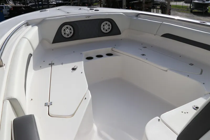 Slide: The Image of 2020 Tidewater 252 LXF boat interior with seating and speakers. - 42