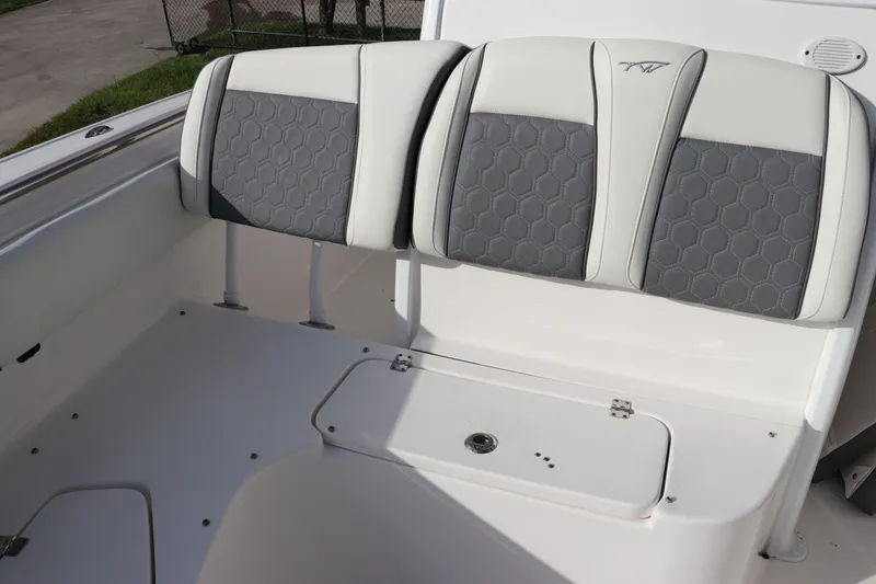 Slide: The Image of 2020 Tidewater 252 LXF boat seating with gray and white upholstery. - 43