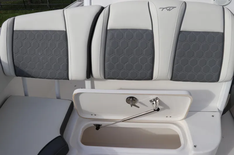 Slide: The Image of 2020 Tidewater 252 LXF boat seat with hexagonal pattern and storage compartment. - 45