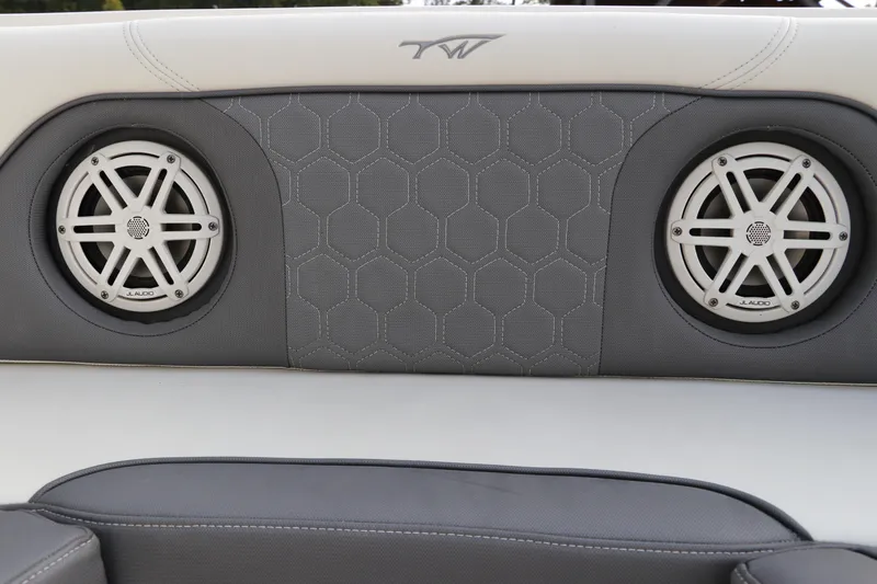 Slide: The Image of 2020 Tidewater 252 LXF boat interior with JL Audio speakers and hexagonal pattern upholstery. - 53