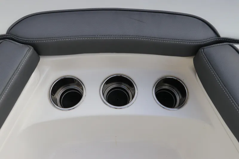 Slide: The Image of 2020 Tidewater 252 LXF boat cup holders with cushioned seating. - 54