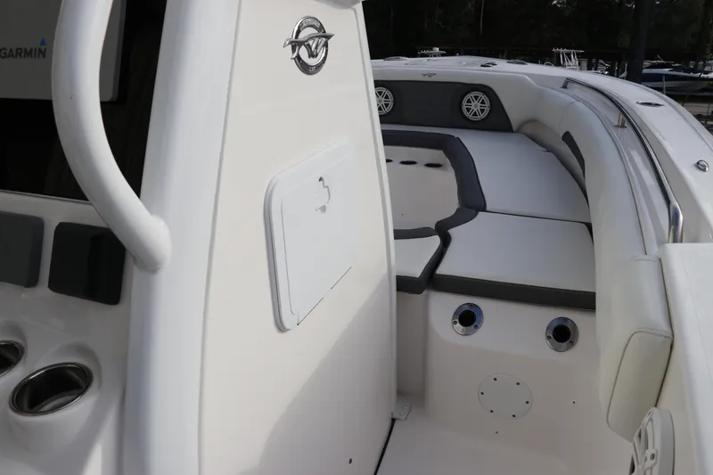 Slide: The Image of 2020 Tidewater 252 LXF boat interior with cushioned seating and modern design. - 62
