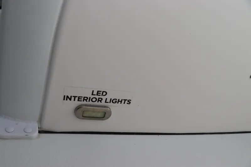Slide: The Image of LED interior light switch on 2020 Tidewater 252 LXF boat. - 63