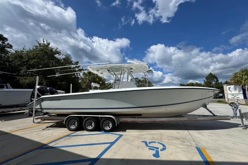 Slide: The Image of 2007 Venture 34 Open boat on trailer under a partly cloudy sky. - 10