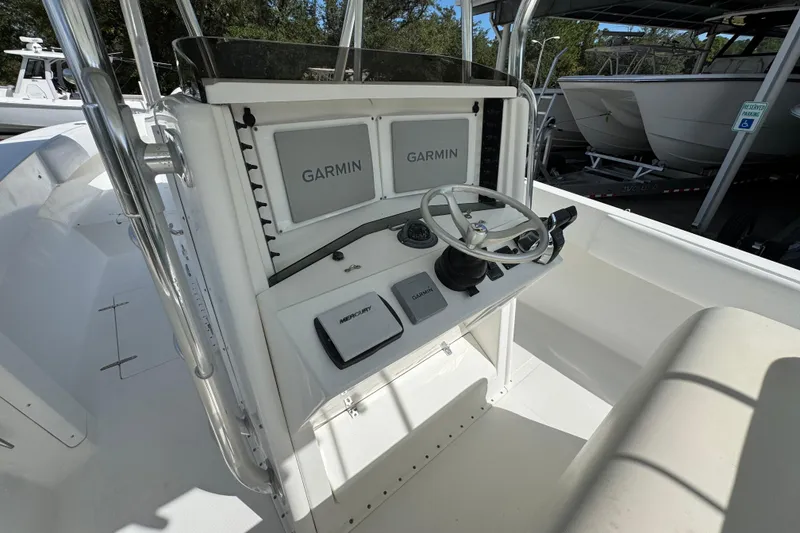 Slide: The Image of 2007 Venture 34 Open boat console with Garmin navigation and Mercury controls. - 30