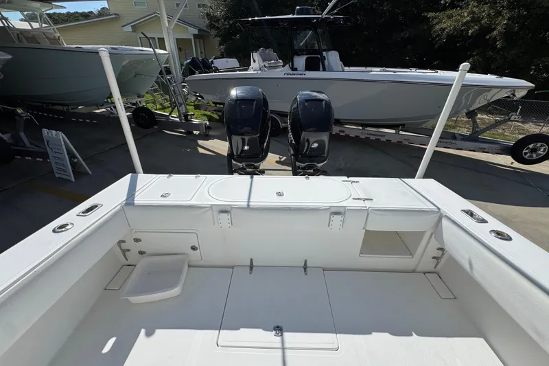 Slide: The Image of 2007 Venture 34 Open boat with dual engines, docked outdoors. - 37