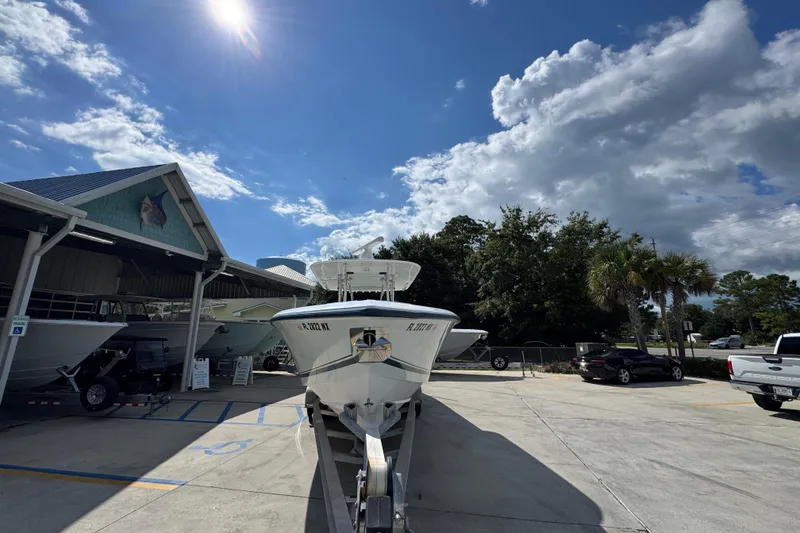 Slide: The Image of 2007 Venture 34 Open boat on trailer under sunny sky at dealership. - 6