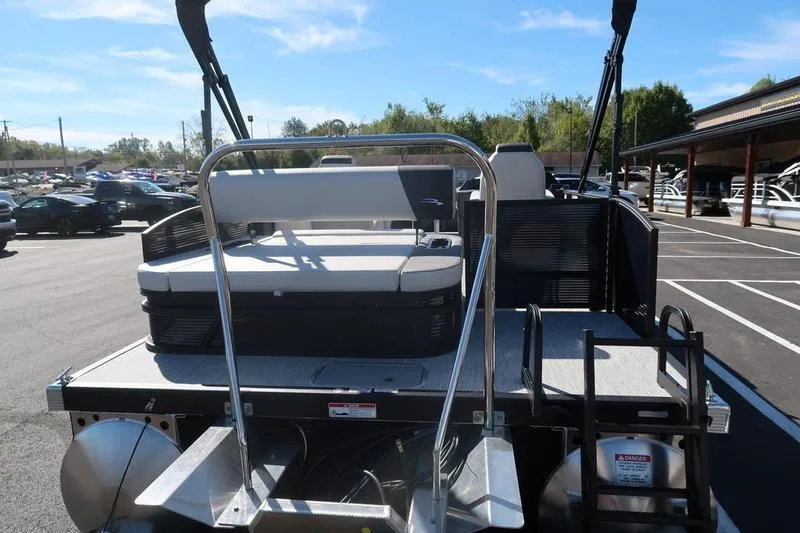 Slide: The Image of 2026 Bennington S Swingback 22 SSB pontoon boat in a parking lot. - 10
