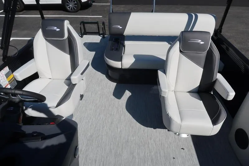 Slide: The Image of 2026 Bennington S Swingback 22 SSB boat seat, featuring sleek gray and black upholstery. - 12